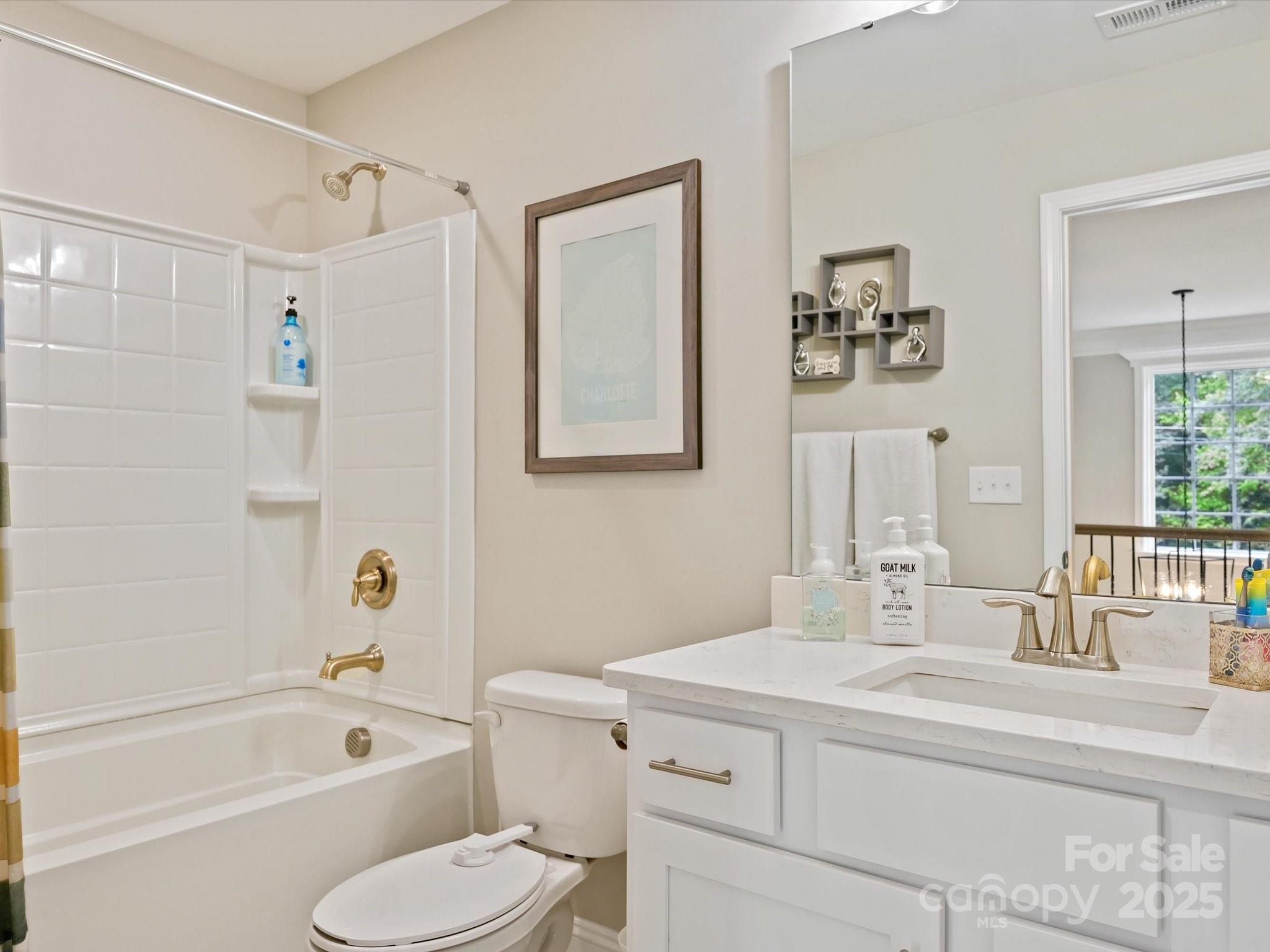 2901 South Point Road Belmont, NC 28012 - Photo 32 of 35 a bathroom with a toilet sink and bathtub