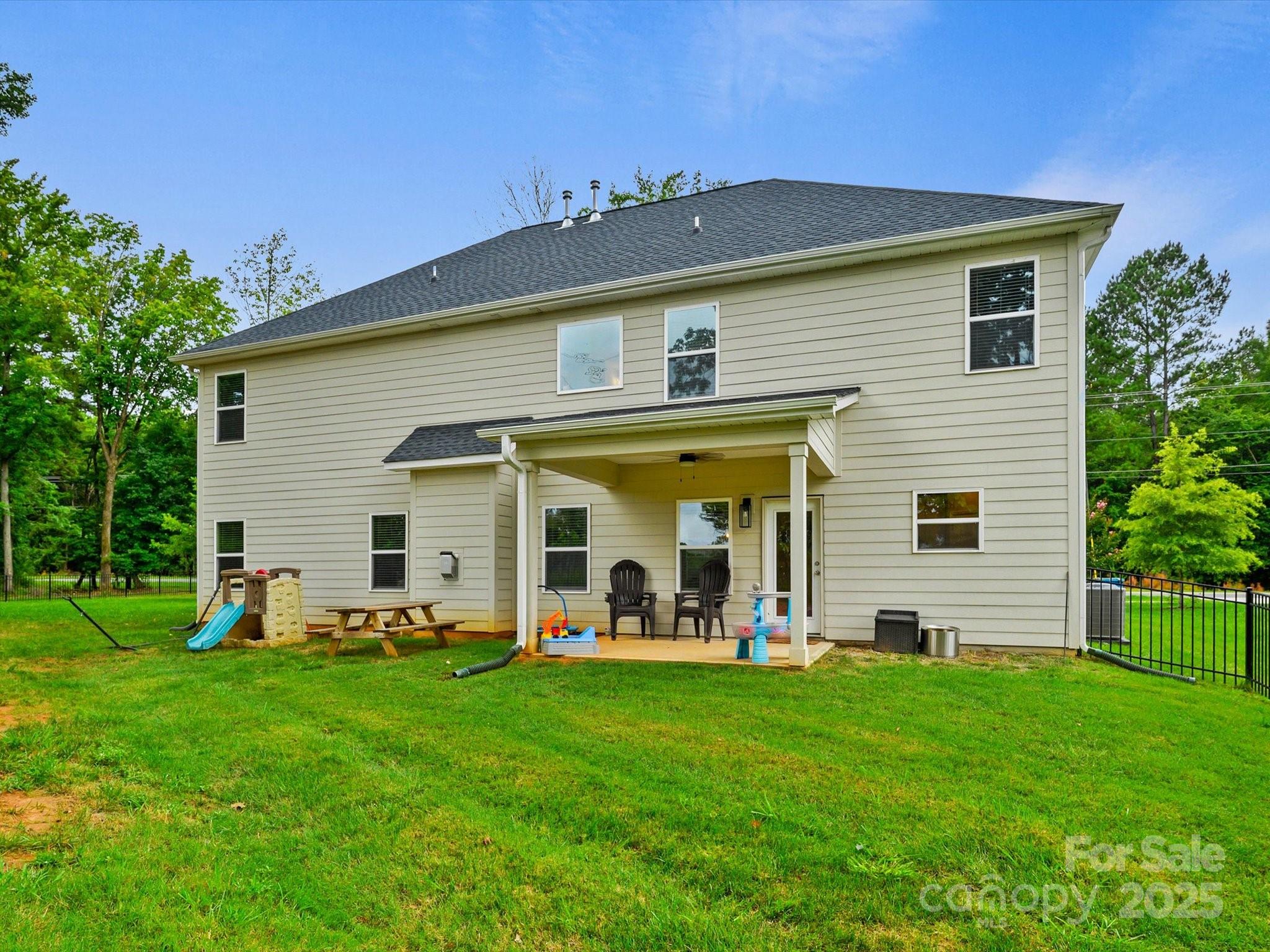 2901 South Point Road Belmont, NC 28012 - Photo 34 of 35 a view of a house with a backyard