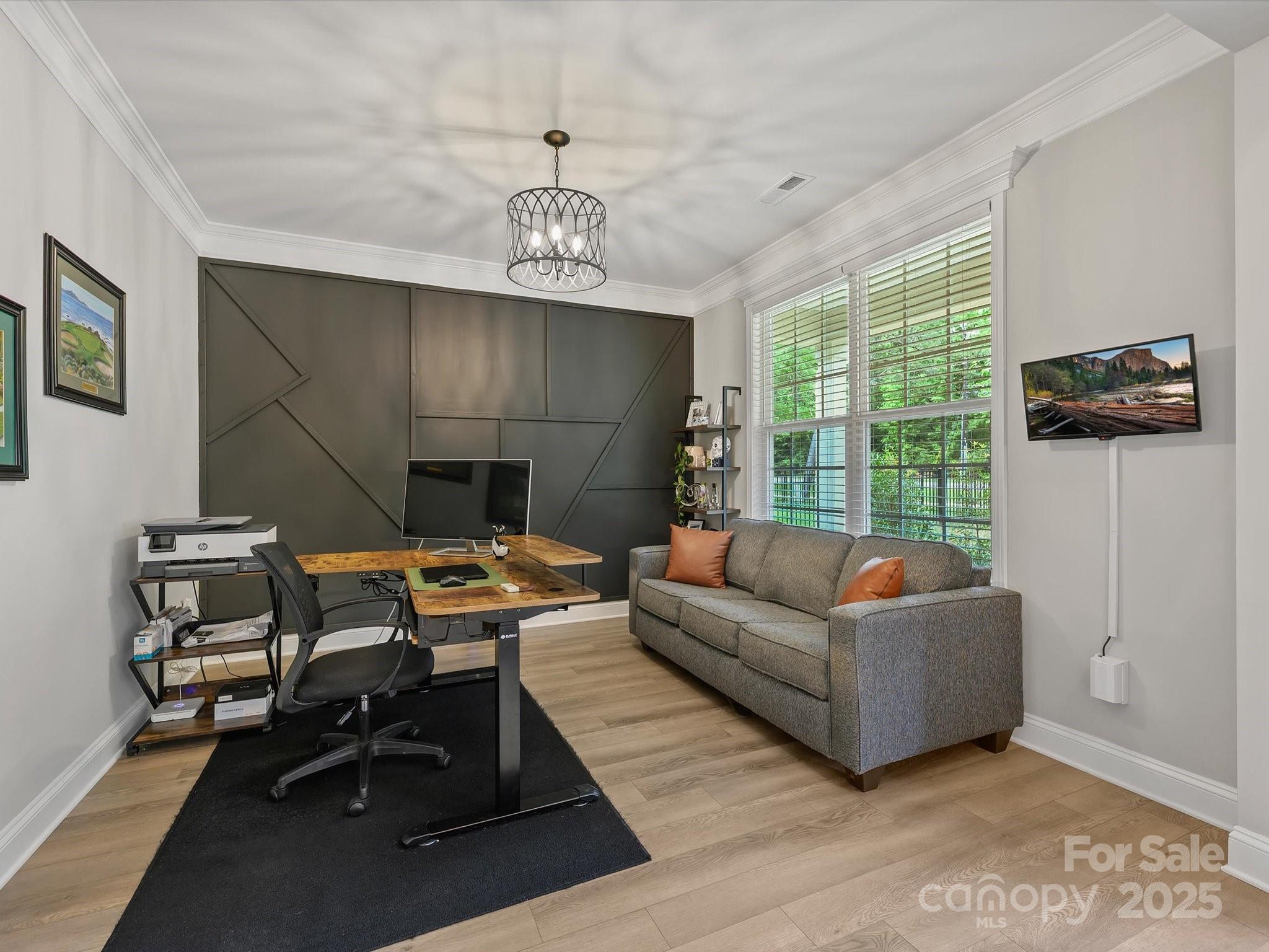 2901 South Point Road Belmont, NC 28012 - Photo 5 of 35 a living room with furniture a fireplace and a flat screen tv