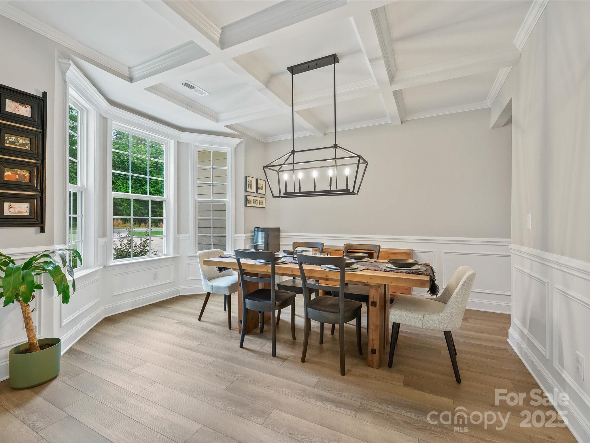 2901 South Point Road Belmont, NC 28012 - Photo 6 of 35 a view of a dining room with furniture window and wooden floor
