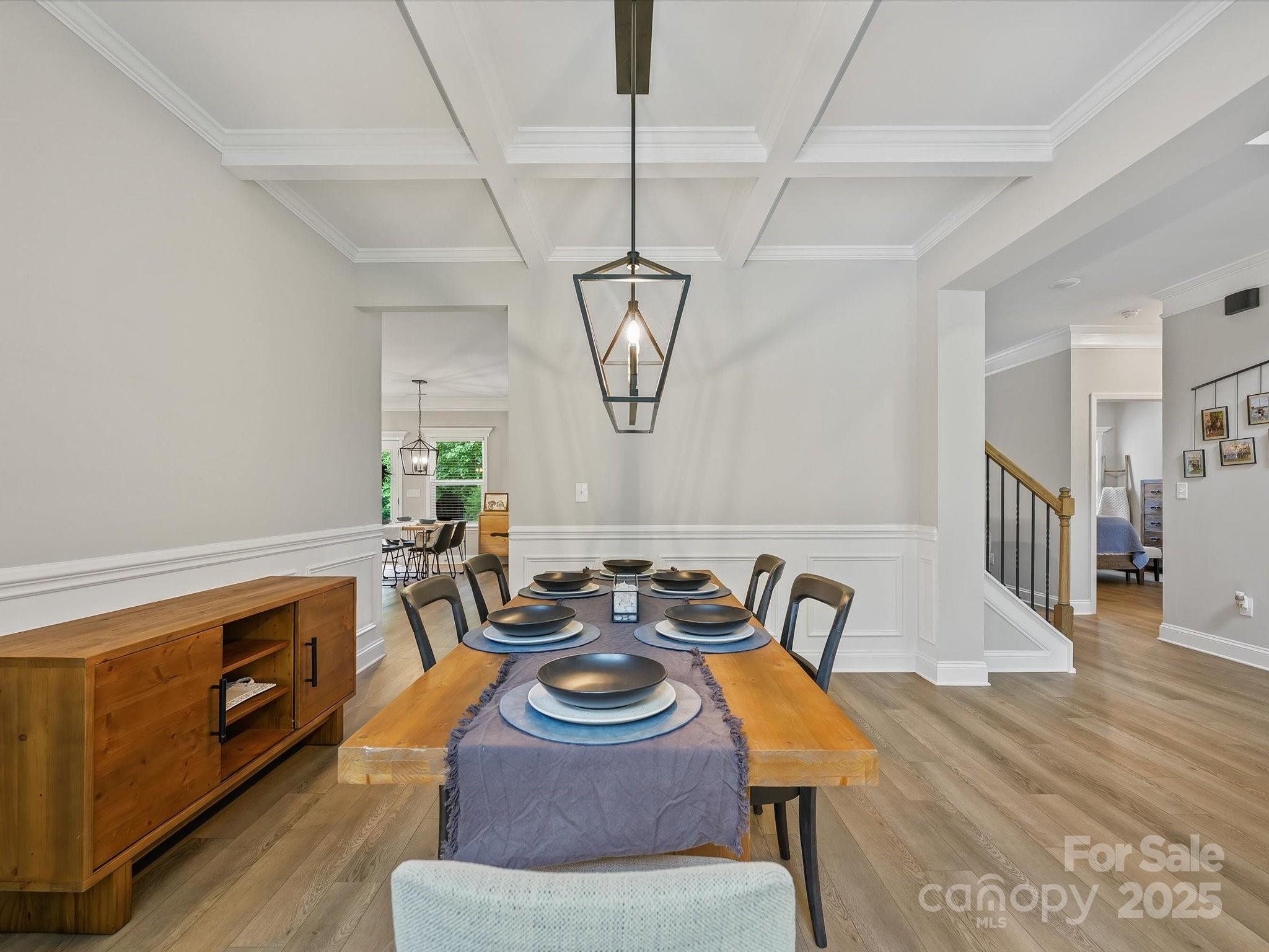 2901 South Point Road Belmont, NC 28012 - Photo 8 of 35 a view of a dining room with furniture a chandelier and wooden floor