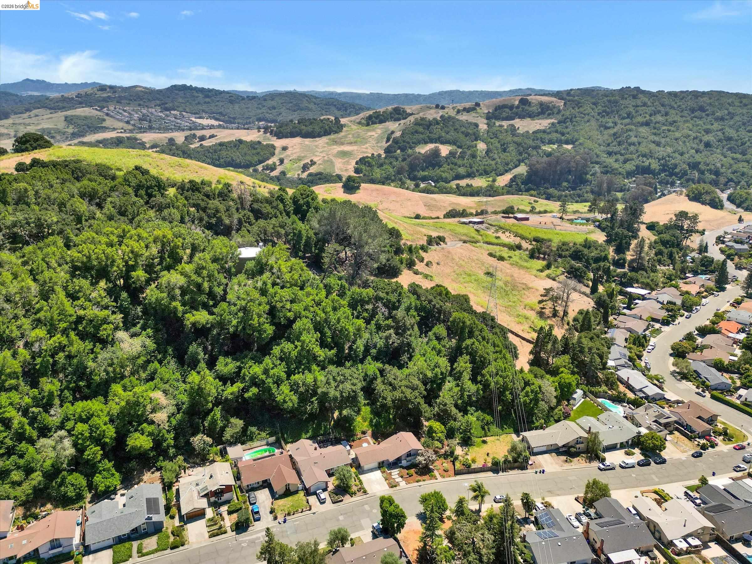 2826 Wright Avenue Pinole, CA 94564 - Photo 59 of 70 Expansive property bordered by lush green hills and mature trees
