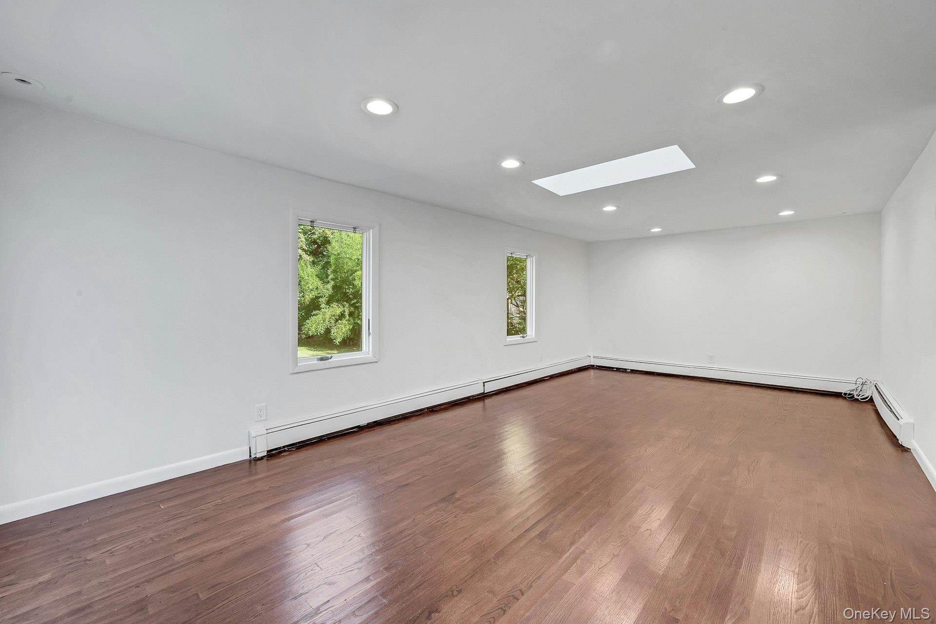 13 Colonial Road Scarsdale, NY 10583 - Photo 10 of 33 Spacious family room with skylight to maximize natural light