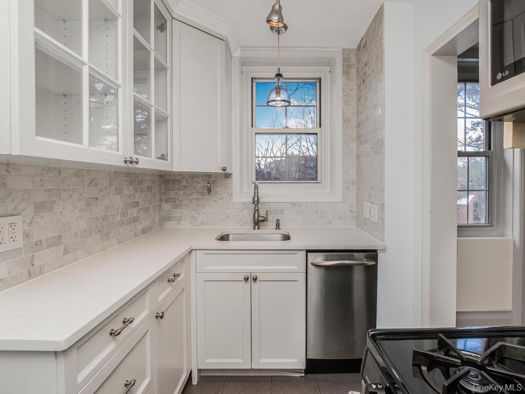 1332 Midland Avenue, Unit 3F Bronxville, NY 10708 - Photo 11 of 21 a kitchen with a sink cabinets and window