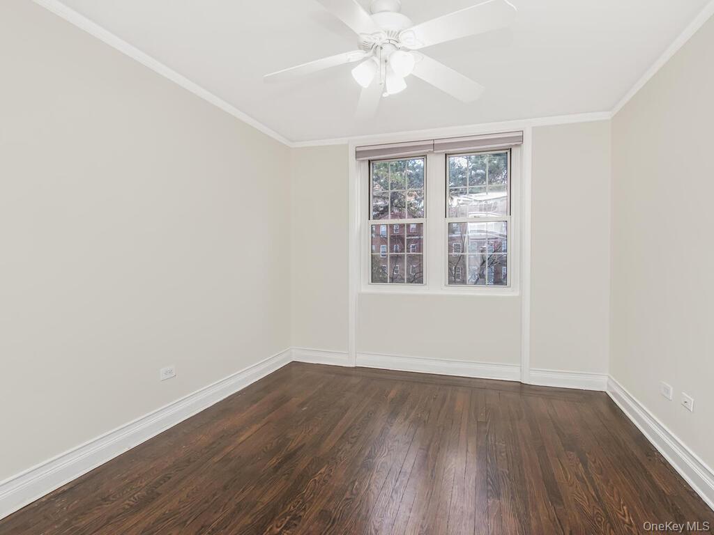 1332 Midland Avenue, Unit 3F Bronxville, NY 10708 - Photo 14 of 21 wooden floor in an empty room with a window