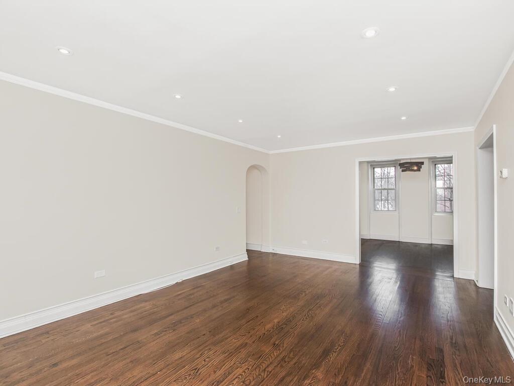 1332 Midland Avenue, Unit 3F Bronxville, NY 10708 - Photo 3 of 21 a view of an empty room with wooden floor and a window