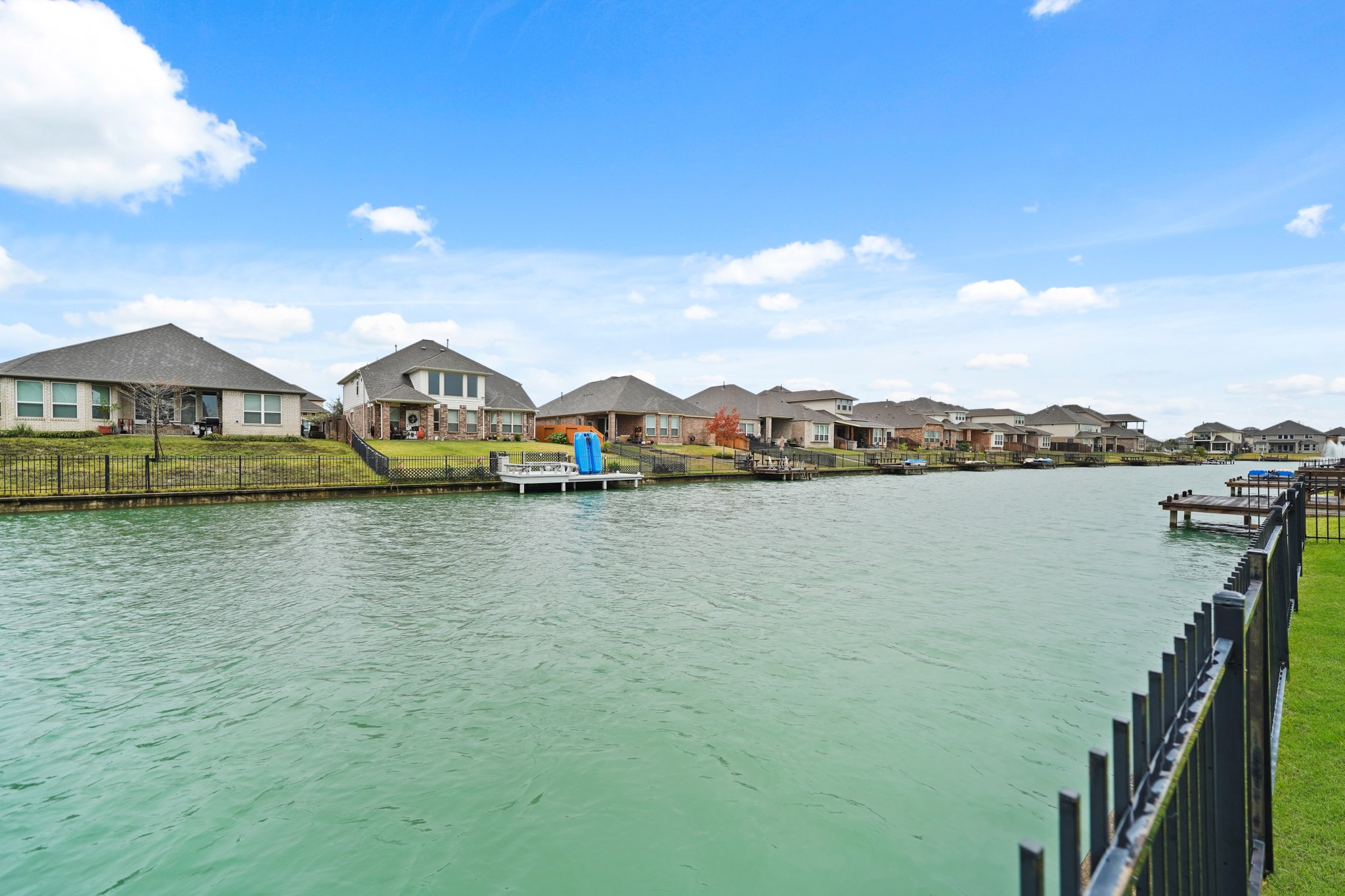 24031 Corinaldo Court Katy, TX 77493 - Photo 3 of 23 a view of a lake with houses in the background