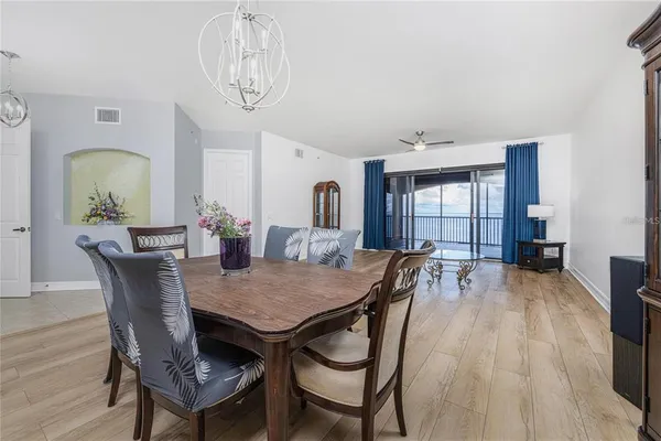 a large white kitchen with a large window