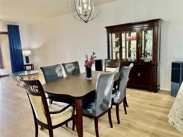 a kitchen with stainless steel appliances granite countertop a stove top oven a sink a counter space and cabinets