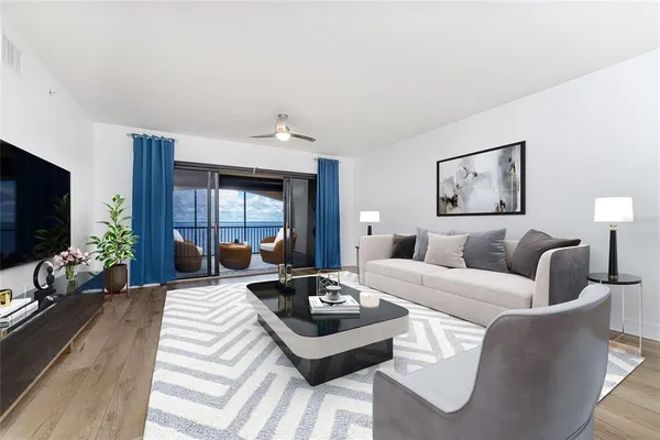 a bedroom with a bed mirror on desk and a window