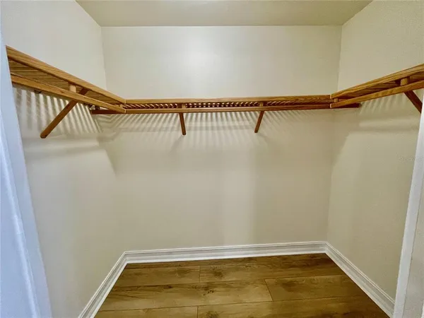 a view of a dining room with furniture and a large window