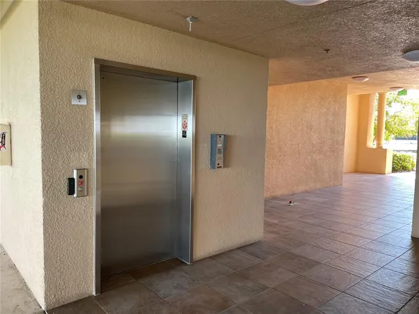 a view of an empty room with a fireplace