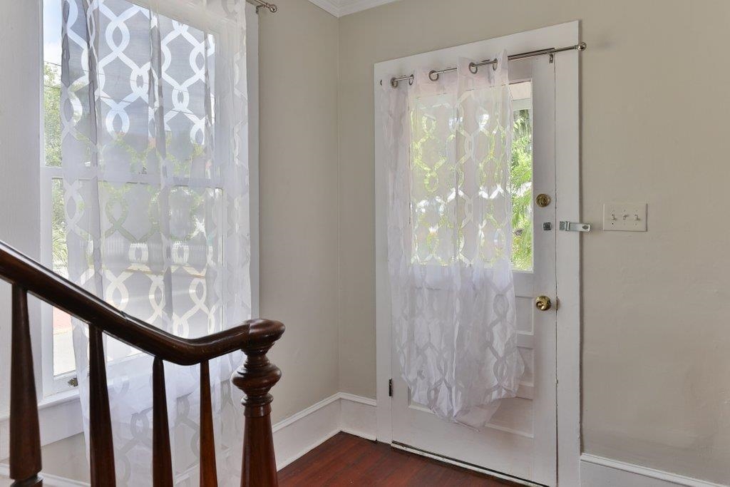 40 Abbott Street St. Augustine, FL 32084 - Photo 11 of 58 Entryway featuring dark wood finished floors and ornamental molding