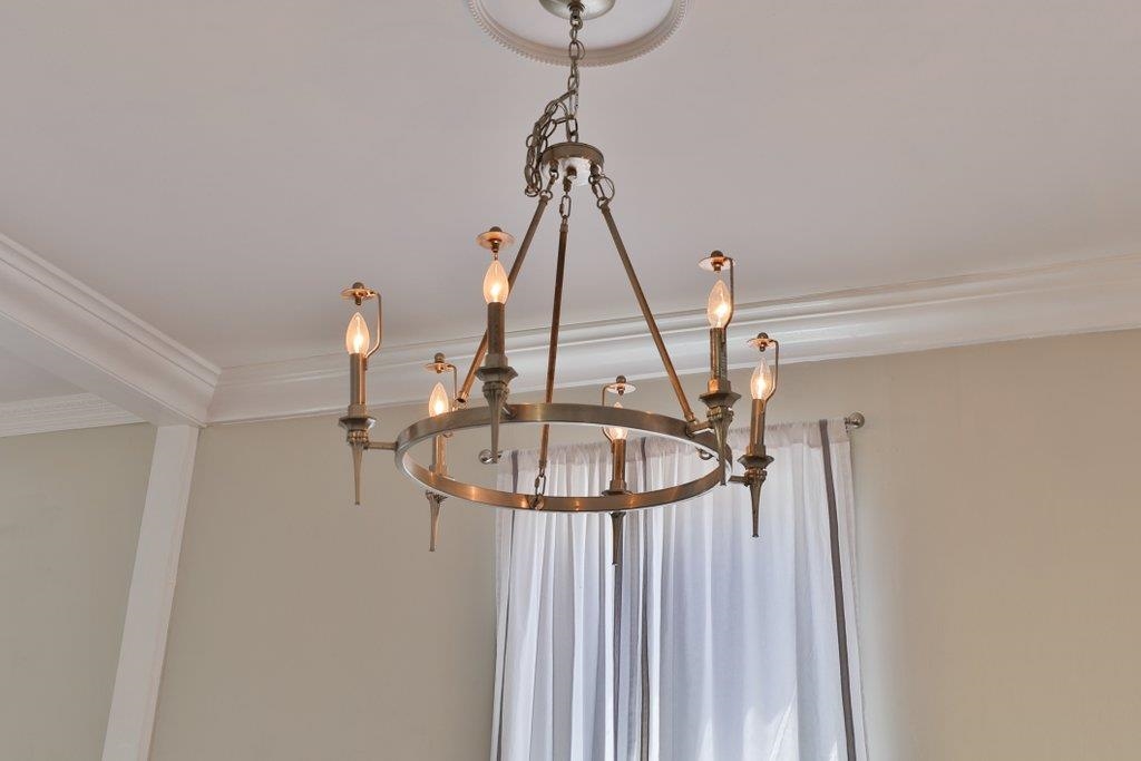 40 Abbott Street St. Augustine, FL 32084 - Photo 17 of 58 Detailed view of crown molding and a chandelier