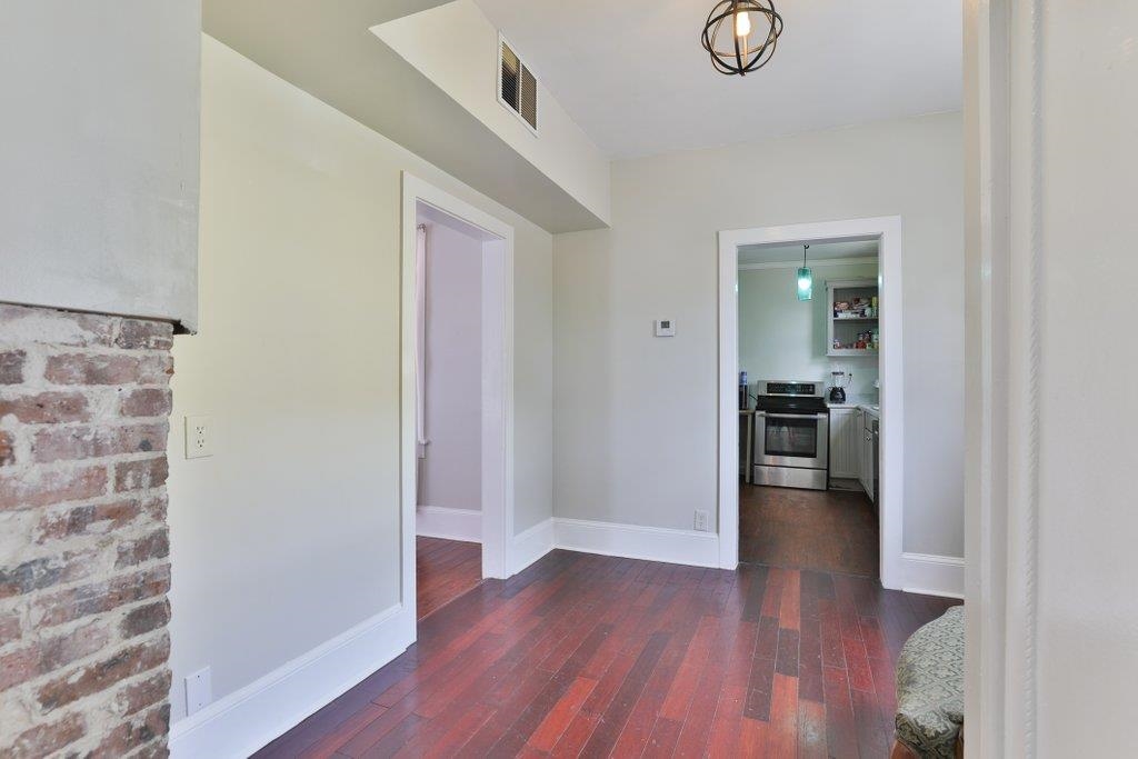 40 Abbott Street St. Augustine, FL 32084 - Photo 19 of 58 Hallway with dark wood finished floors and baseboards