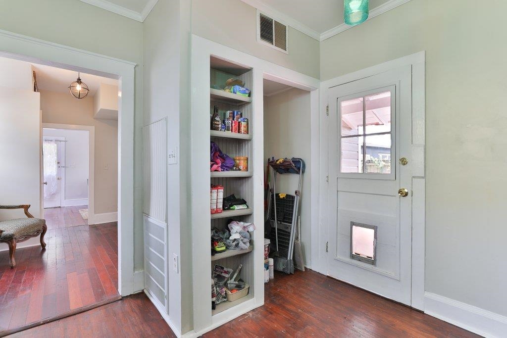 40 Abbott Street St. Augustine, FL 32084 - Photo 24 of 58 Entryway with hardwood / wood-style flooring, crown molding, and built in features