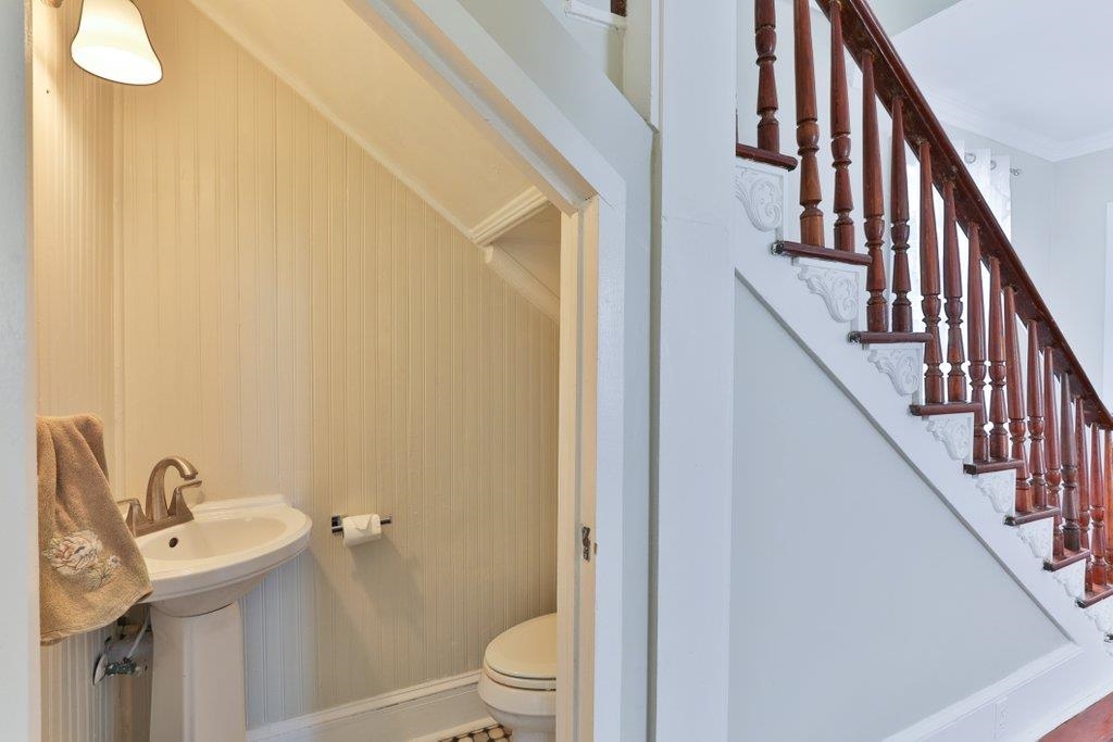 40 Abbott Street St. Augustine, FL 32084 - Photo 28 of 58 Half bath featuring toilet and baseboards