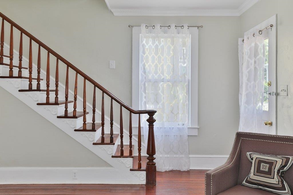 40 Abbott Street St. Augustine, FL 32084 - Photo 30 of 58 Foyer with wood finished floors, crown molding, and stairway