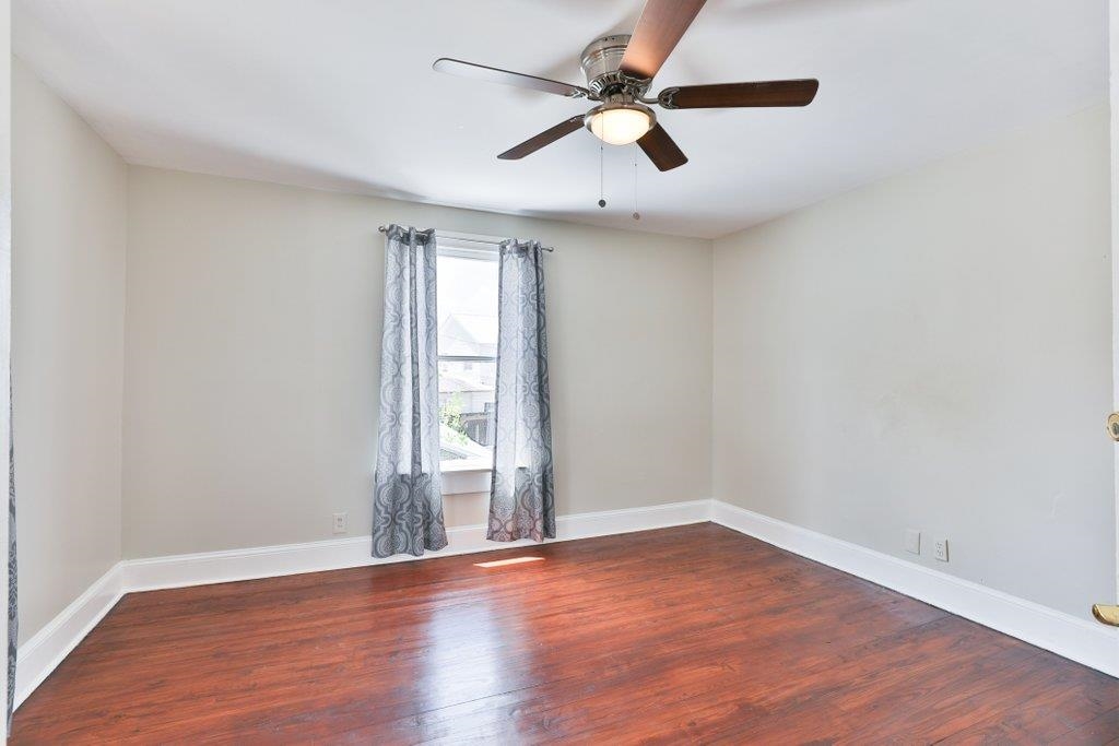 40 Abbott Street St. Augustine, FL 32084 - Photo 33 of 58 Empty room featuring dark wood-style floors and ceiling fan