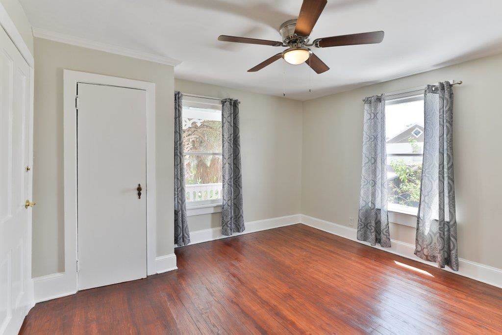 40 Abbott Street St. Augustine, FL 32084 - Photo 35 of 58 Unfurnished bedroom featuring wood-type flooring, multiple windows, and a ceiling fan