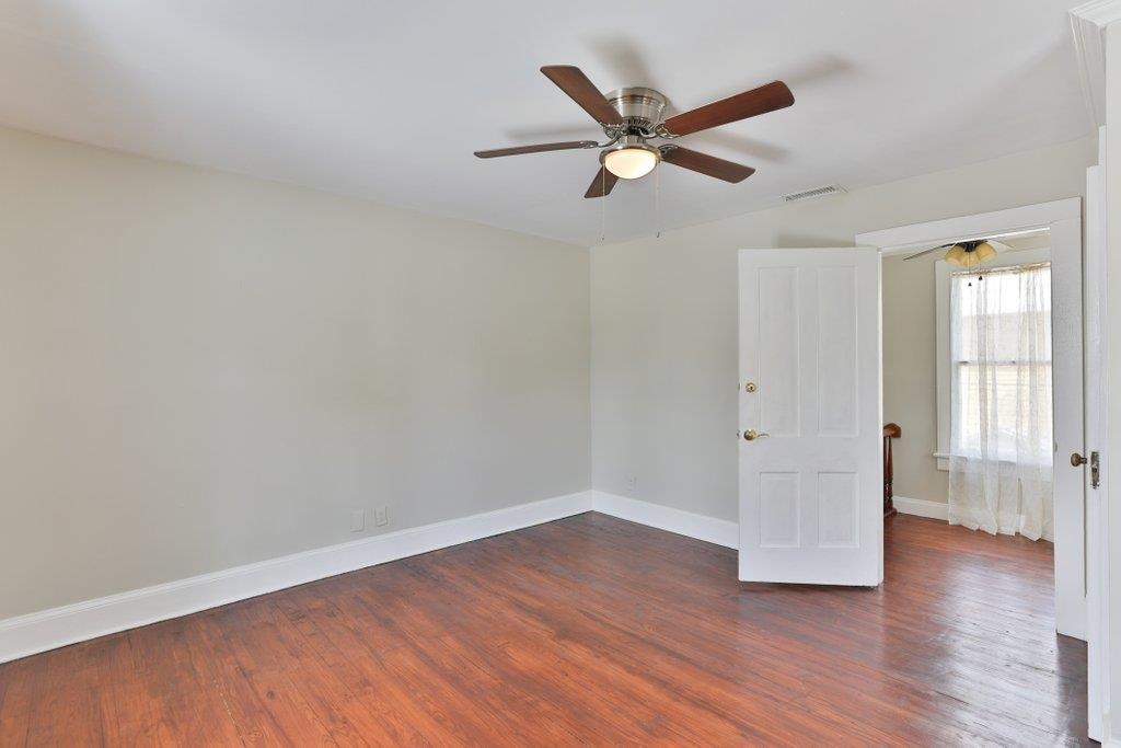 40 Abbott Street St. Augustine, FL 32084 - Photo 36 of 58 Unfurnished room featuring dark wood-type flooring and ceiling fan