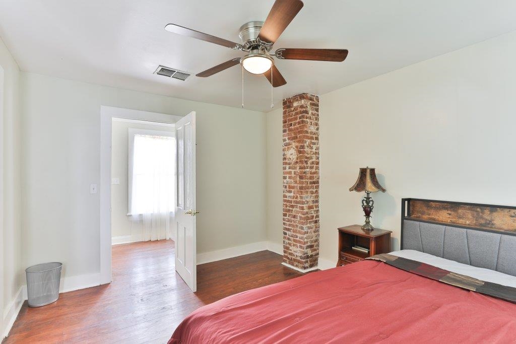 40 Abbott Street St. Augustine, FL 32084 - Photo 44 of 58 Bedroom featuring dark wood-type flooring and ceiling fan