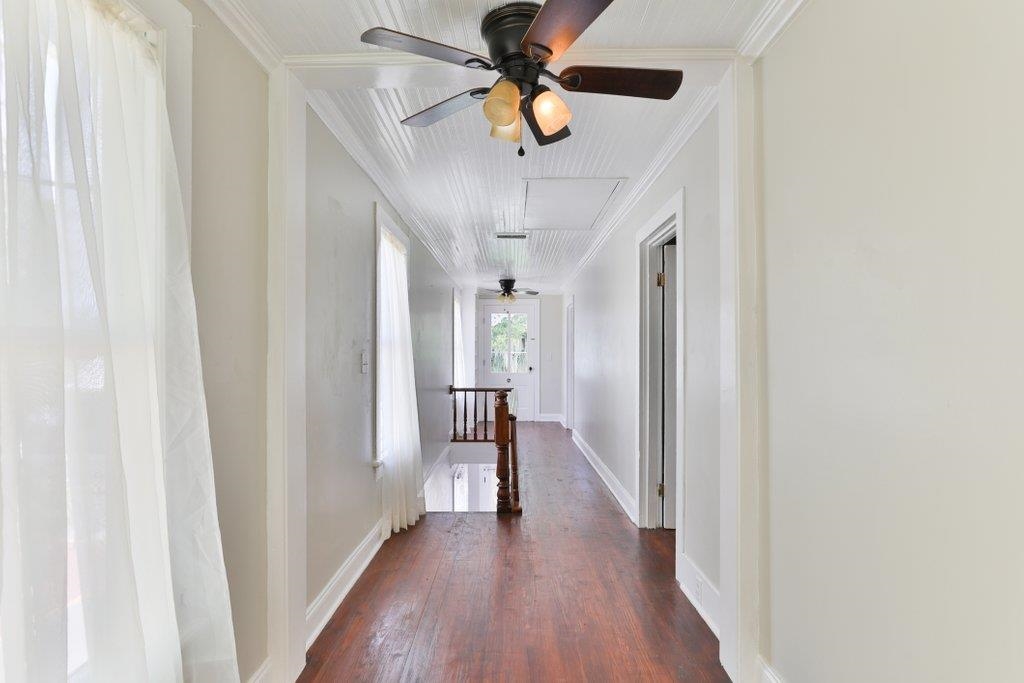 40 Abbott Street St. Augustine, FL 32084 - Photo 46 of 58 Hall featuring an upstairs landing, dark wood finished floors, and ornamental molding