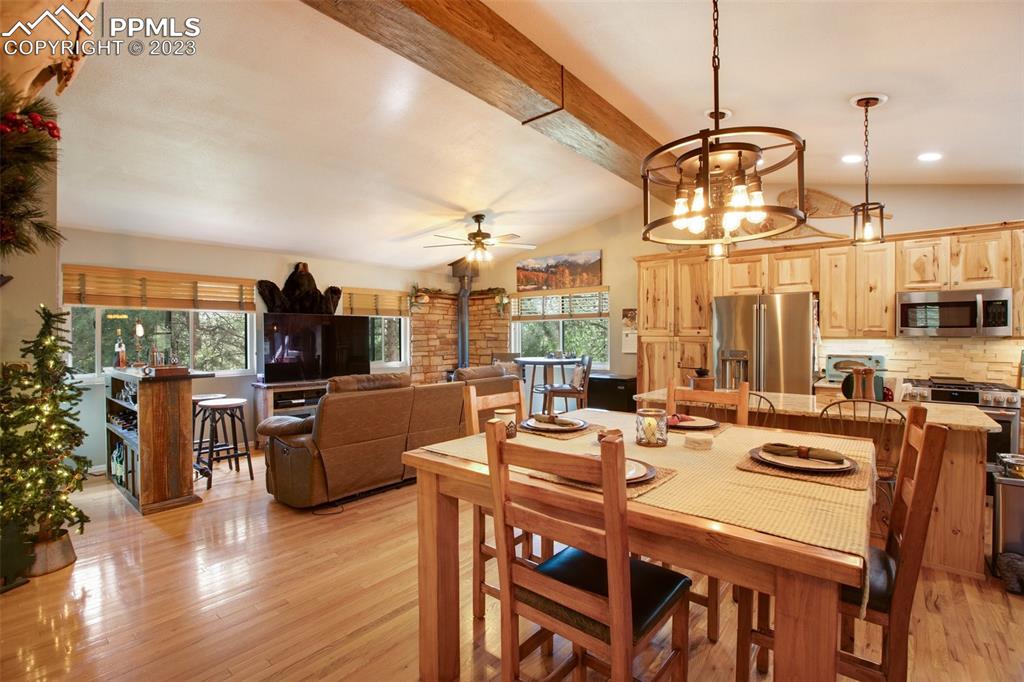 290 North Mountain Estates Road Florissant, CO 80816 - Photo 15 of 32 a view of a dining room with furniture window and wooden floor