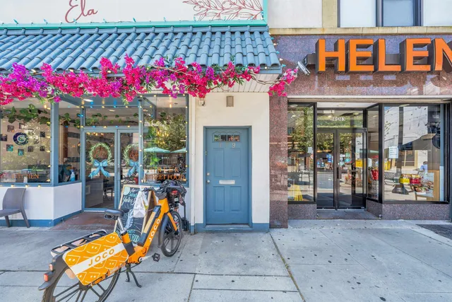 a view of a cafe with sitting area