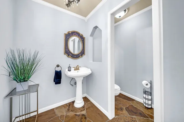 a view of a bathroom with a sink and mirror