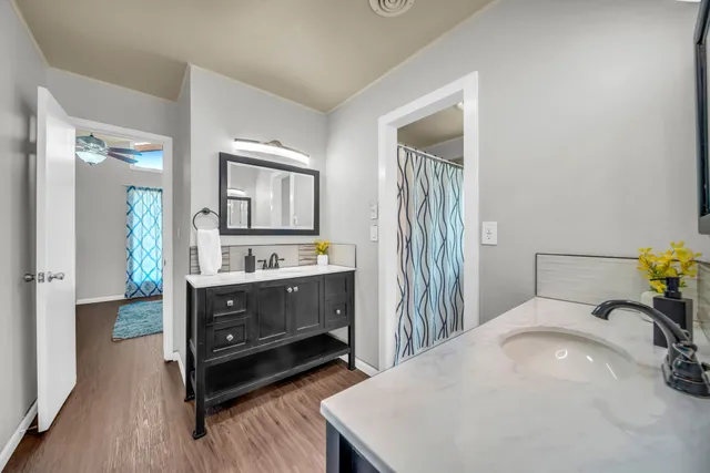 a bedroom with a bed and a dresser