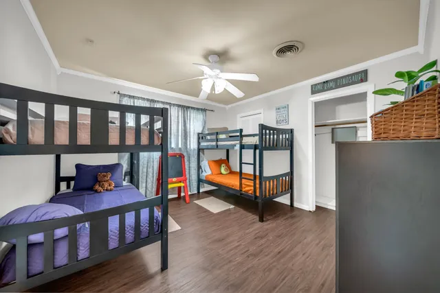 a bedroom with furniture and a book shelf
