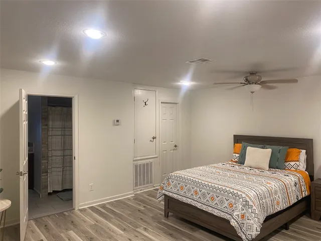 a bedroom with a bed and a closet