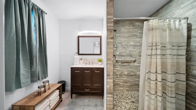 a view of a backyard with potted plants and a large tree