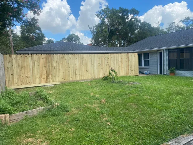 a view of a house with backyard porch and garden