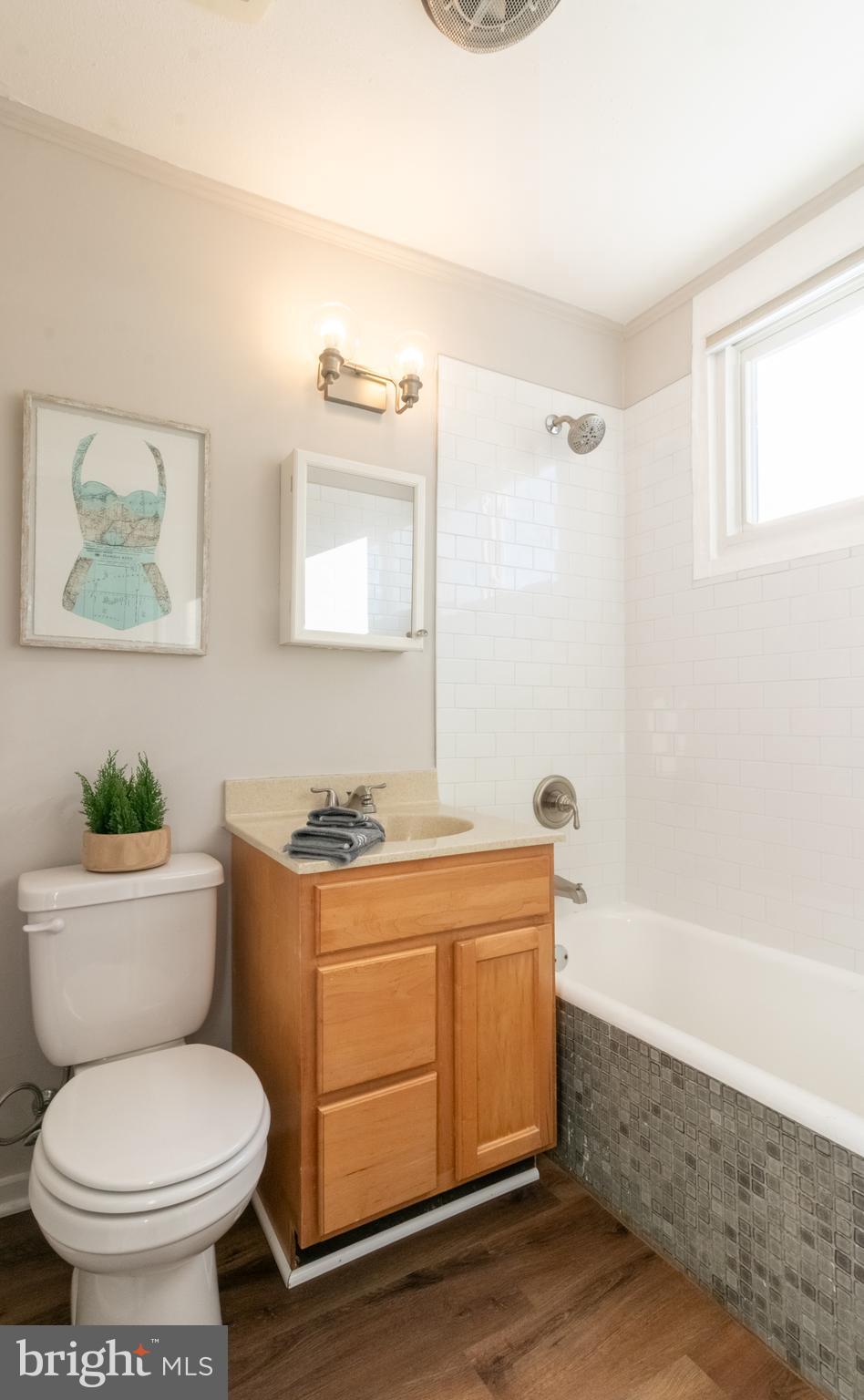 4 Plateau Place Greenbelt, MD 20770 - Photo 18 of 21 a bathroom with a toilet a sink and bathtub