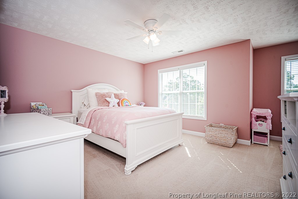 63 Colonist Place Cameron, NC 28326 - Photo 22 of 32 a bedroom with a bed and a window