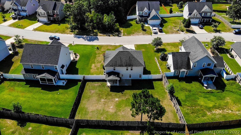63 Colonist Place Cameron, NC 28326 - Photo 3 of 32 an aerial view of a swimming pool with a yard and seating area