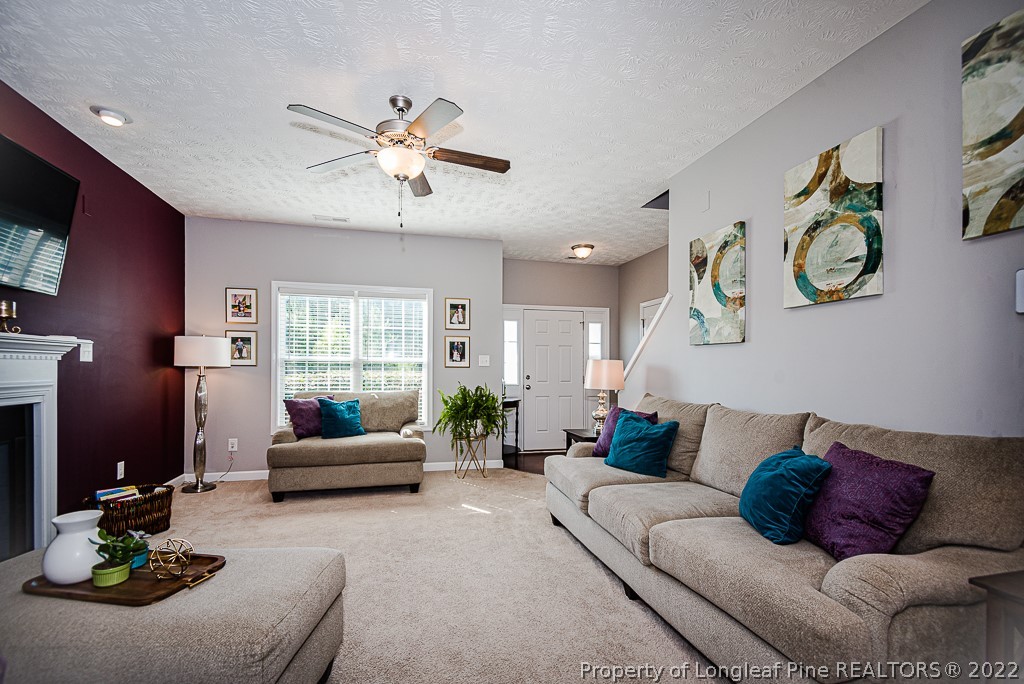 63 Colonist Place Cameron, NC 28326 - Photo 10 of 32 a living room with furniture and a large window