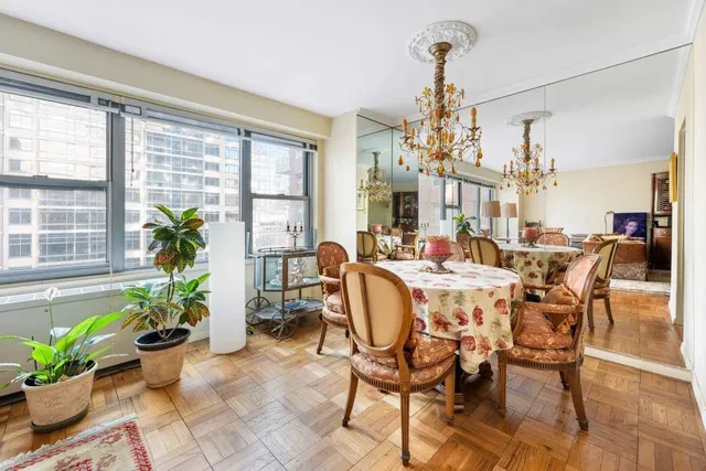 a living room with furniture fireplace and a table