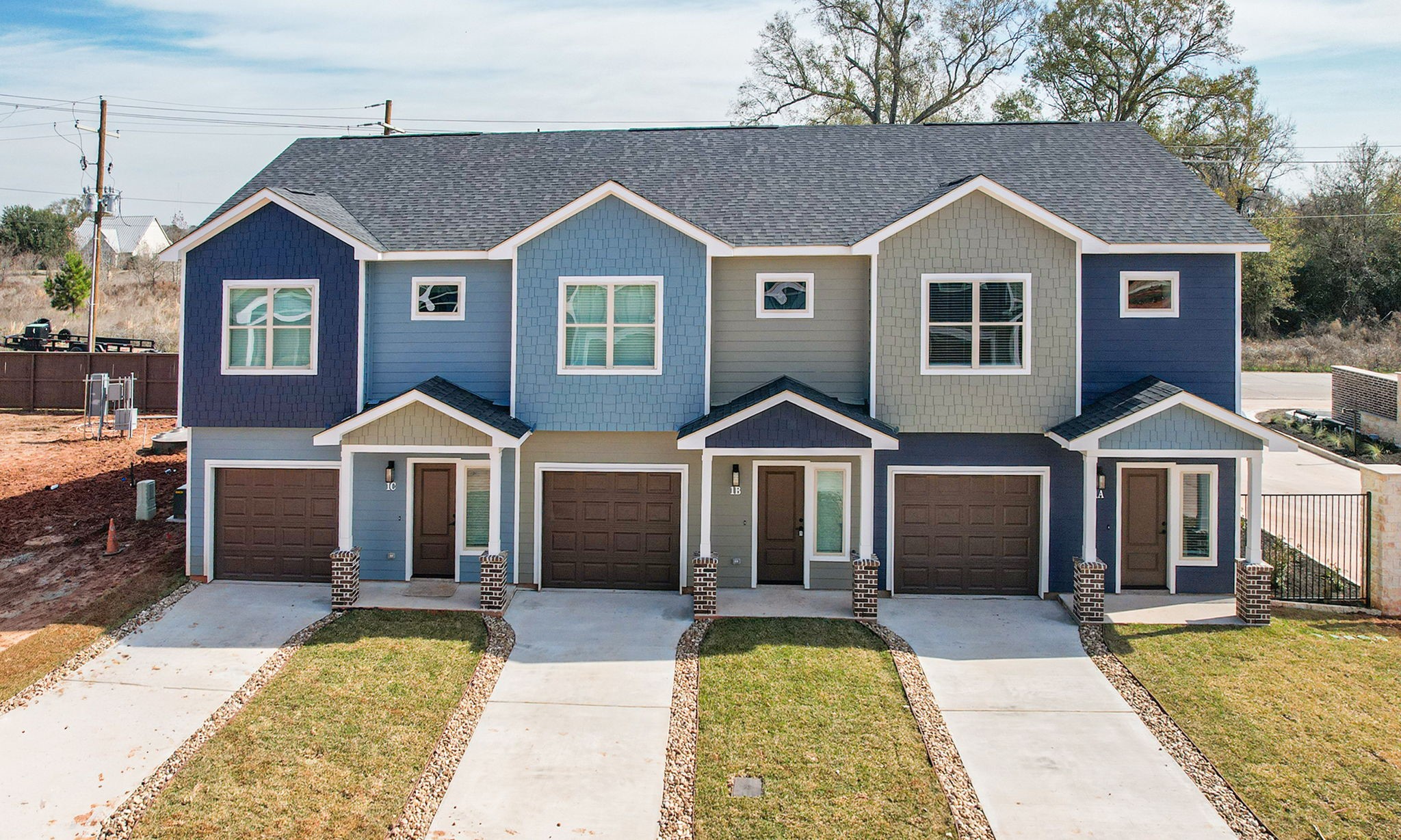 a front view of a house with yard porch and furniture