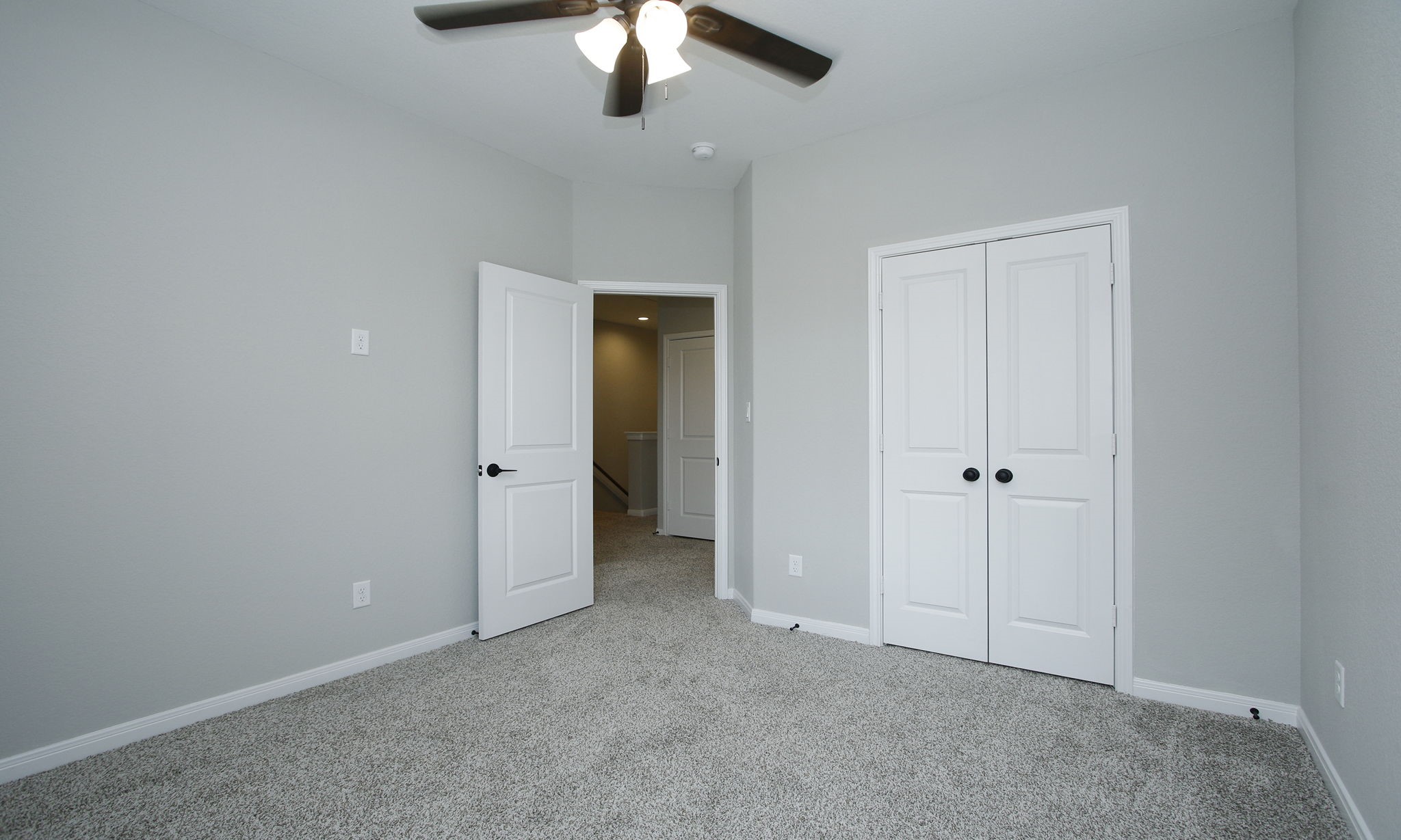 14010 Longstreet Road, Unit 9 Willis, TX 77318 - Photo 25 of 50 an empty room with chandelier fan