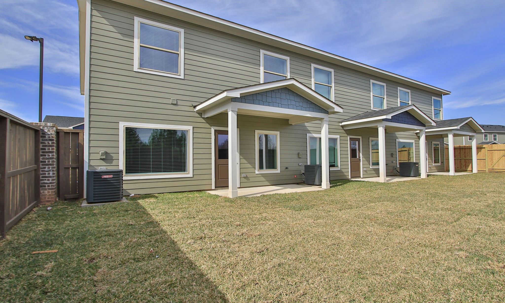 14010 Longstreet Road, Unit 9 Willis, TX 77318 - Photo 44 of 50 a front view of a house with a yard