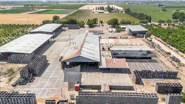 an aerial view of a house with a ocean view