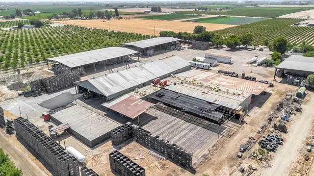 an aerial view of a house with a lake view