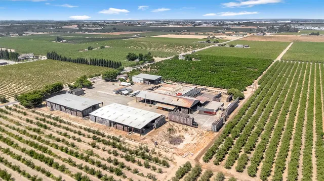an aerial view of a house with outdoor space