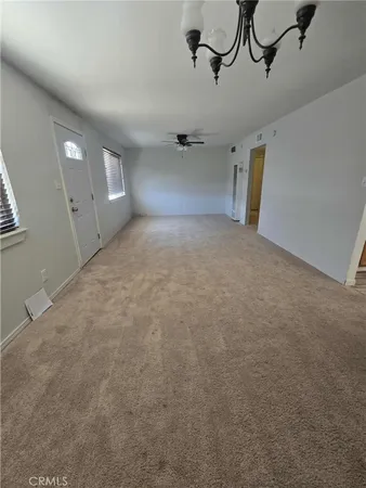 a view of a room with rack and windows