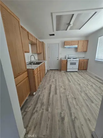 a view of a kitchen with electric appliances
