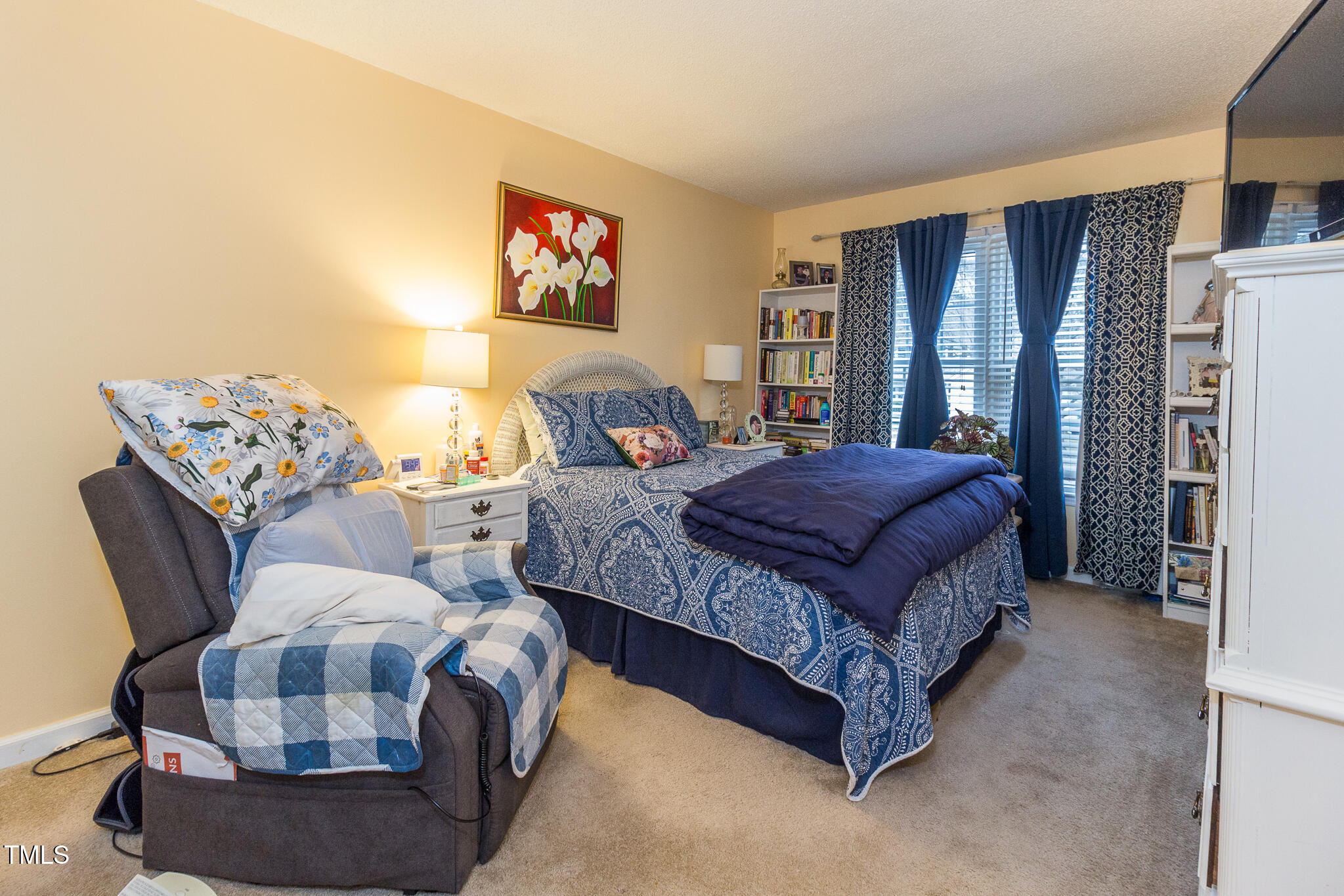 4212 Birmingham Way Raleigh, NC 27604 - Photo 13 of 17 a bedroom with a bed and glass window