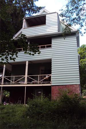 6 Beckman Street Worcester, MA 01607 - Photo 15 of 18 a view of house with backyard space and garden